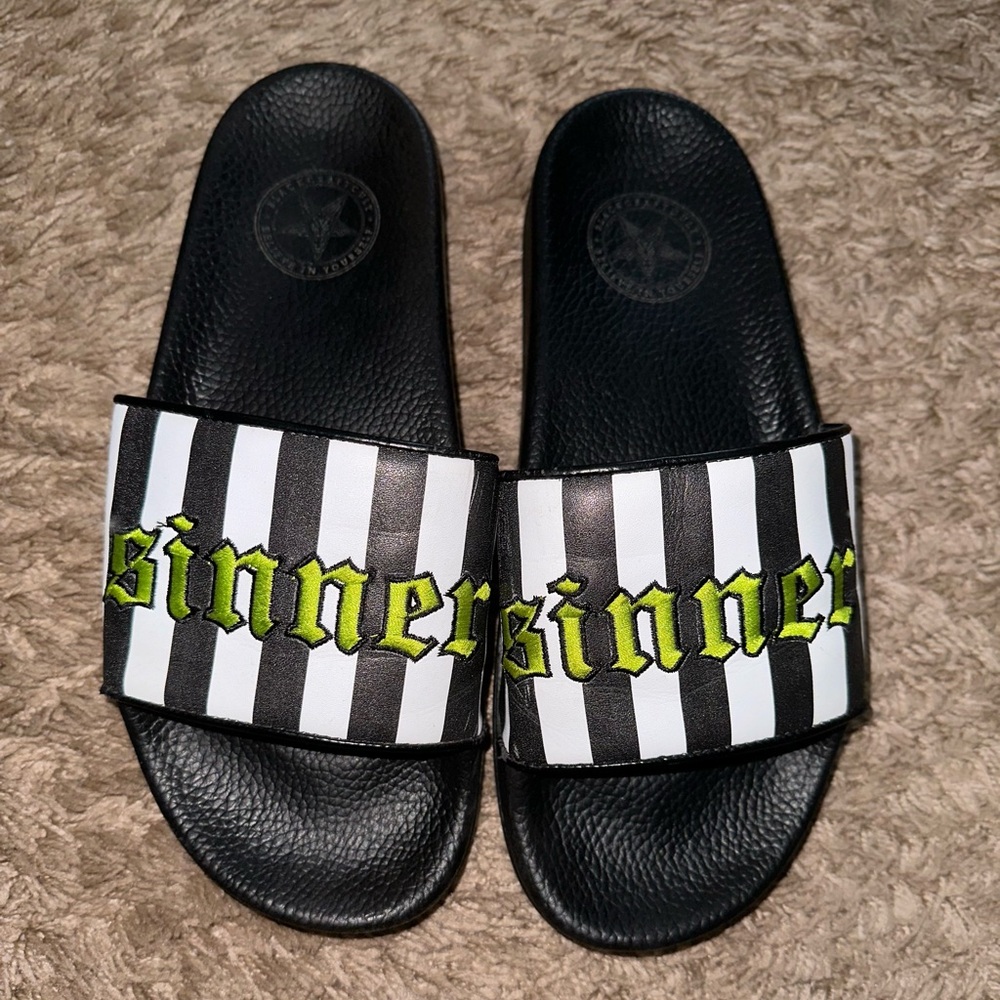 Black craft “Sinner” slip ons